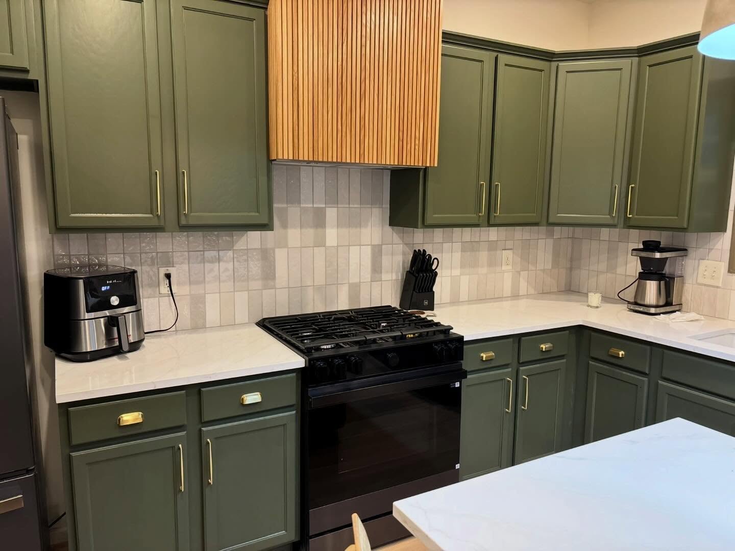 Painted green kitchen cabinets