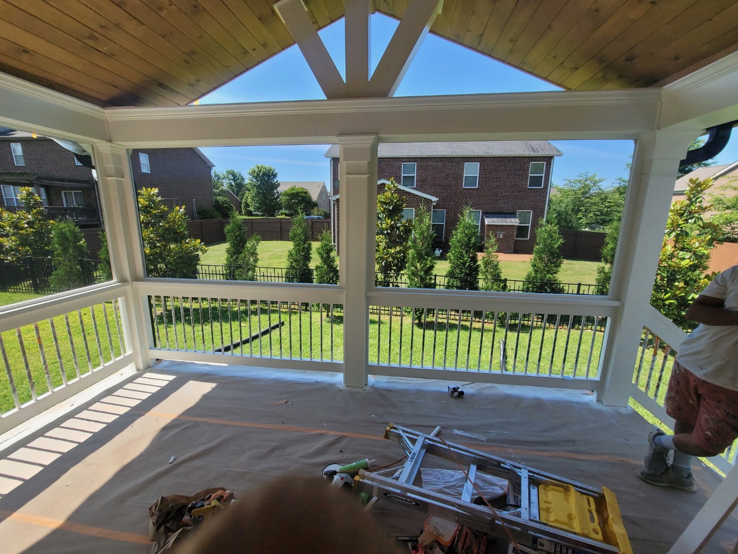 Painted deck and fence with covered patio