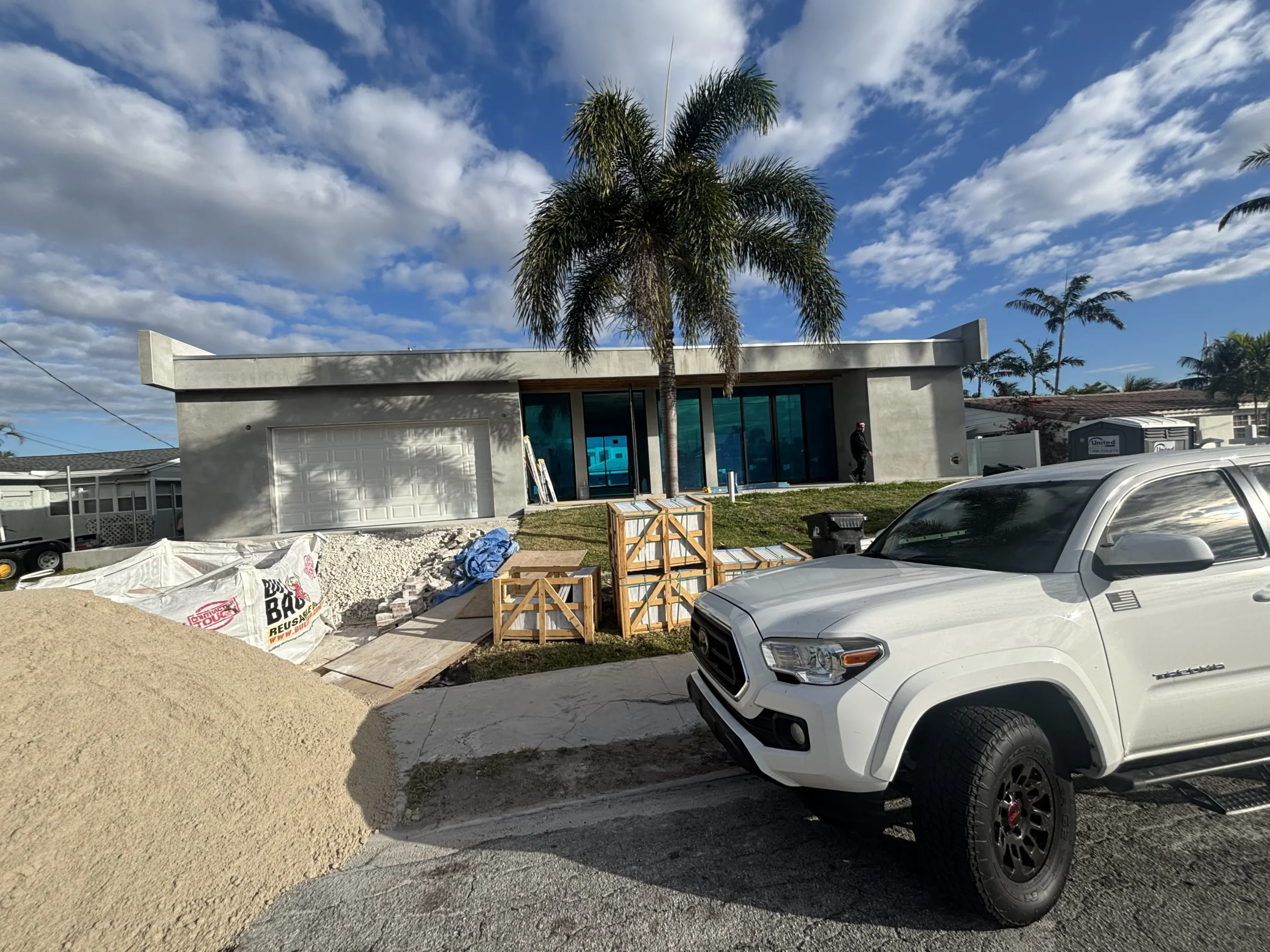 House under construction with painting materials